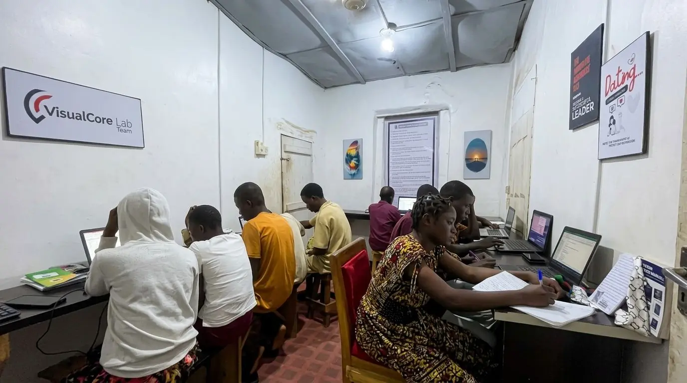 A full class of trainees at workstations in the Toshworld training room.
