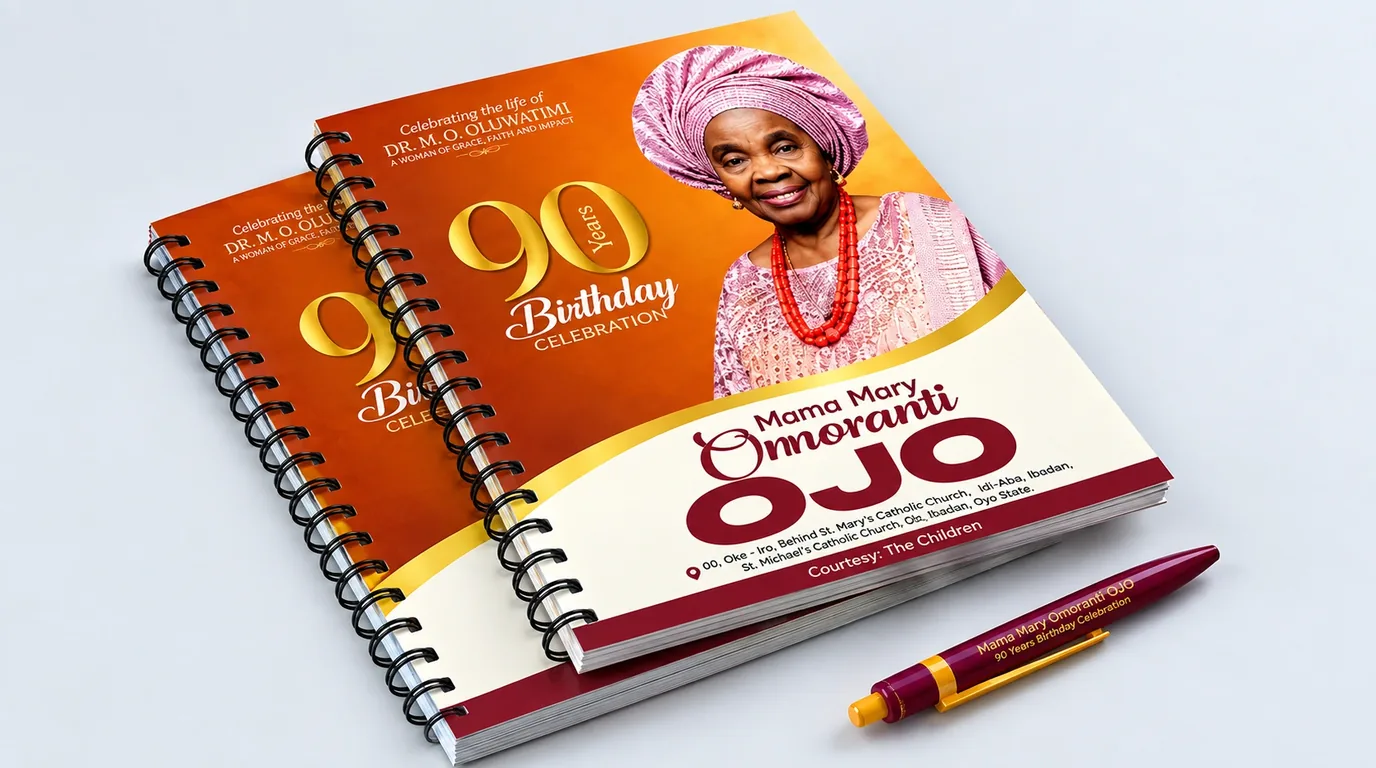 Two wire-bound souvenir jotters printed for a 90th birthday celebration, with a branded pen.